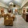 media room with recliners, couch and tv