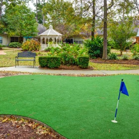 Find your perfect fit at The Auberge at The Woodlands outdoor putting green