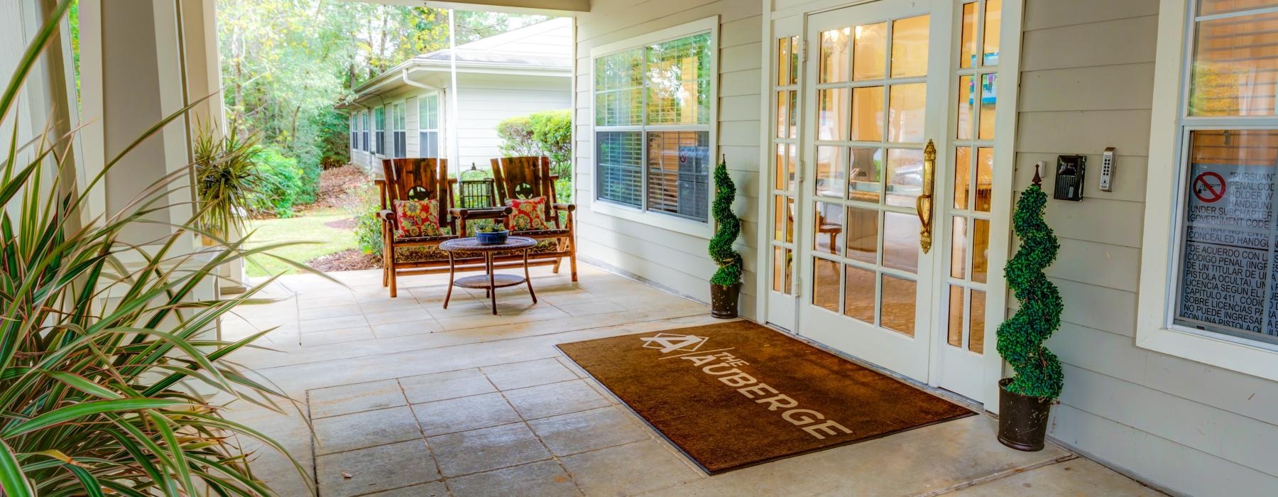 leasing office covered porch with chairs and table