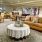 well lit club room with couches and tables